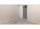 Bedroom with neutral carpeting, two electrical outlets, and a closet with sliding doors at 1775 Esteban Ave, Laughlin, NV 89029