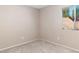 Cozy bedroom with a window view and neutral carpet flooring at 1775 Esteban Ave, Laughlin, NV 89029