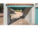 Attached covered carport featuring a tile roof and painted support beams at 1775 Esteban Ave, Laughlin, NV 89029