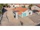 A light colored single-story home featuring a vibrant terra cotta roof and a detached carport at 1775 Esteban Ave, Laughlin, NV 89029