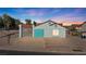 Charming single-story home featuring a tile roof, covered parking, and desert landscaping at 1775 Esteban Ave, Laughlin, NV 89029