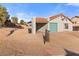 Street-side view showing the home's desert landscaping and attached garage at 1775 Esteban Ave, Laughlin, NV 89029