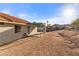 Home exterior showing desert landscaping and covered patio at 1775 Esteban Ave, Laughlin, NV 89029
