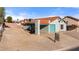 Charming single-story home featuring a teal garage door, tile roof, and low-maintenance desert landscaping at 1775 Esteban Ave, Laughlin, NV 89029