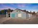 Side view of a single-story home with updated facade and low-maintenance yard at 1775 Esteban Ave, Laughlin, NV 89029