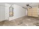 Spacious garage featuring an automatic door, concrete flooring, and utility access at 1775 Esteban Ave, Laughlin, NV 89029