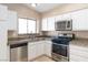 Efficient kitchen featuring stainless steel appliances, and updated cabinets at 1775 Esteban Ave, Laughlin, NV 89029