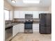 Modern kitchen equipped with stainless steel appliances and efficient layout at 1775 Esteban Ave, Laughlin, NV 89029