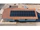 Aerial view showcasing modern solar panels installed on a red tiled roof for energy efficiency at 1775 Esteban Ave, Laughlin, NV 89029