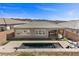 Impressive aerial view of the backyard featuring a pool, spa, firepit and low maintenance landscaping at 18 Via Tiberina, Henderson, NV 89011