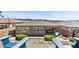 Relaxing backyard features a refreshing pool, low-maintenance landscaping, and comfortable lounge chairs at 18 Via Tiberina, Henderson, NV 89011