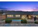 Backyard featuring a sparkling pool and lush landscaping, perfect for outdoor living at 18 Via Tiberina, Henderson, NV 89011