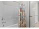Bathroom tub and shower featuring a shower curtain at 18 Via Tiberina, Henderson, NV 89011