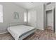 Bright bedroom includes wood floors, a bed, and windows that provide natural light for a peaceful setting at 18 Via Tiberina, Henderson, NV 89011