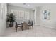 Cozy dining area featuring a modern table, plantation shutters, and ample natural light at 18 Via Tiberina, Henderson, NV 89011