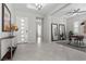 Bright foyer featuring neutral walls, modern light fixtures, and tile flooring, creating a welcoming entrance at 18 Via Tiberina, Henderson, NV 89011