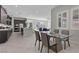 Open-concept kitchen with a large island, stainless steel appliances, and adjacent dining area at 18 Via Tiberina, Henderson, NV 89011