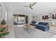Bright living room with a comfortable sofa, modern furniture, and backyard access at 18 Via Tiberina, Henderson, NV 89011