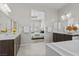 Luxurious bathroom featuring dual vanities, a soaking tub, and neutral tones at 18 Via Tiberina, Henderson, NV 89011