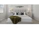 Bright main bedroom showcasing a comfortable bed, stylish side tables, and decorative accents at 18 Via Tiberina, Henderson, NV 89011