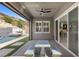 Covered patio with a dining area overlooks the pool and manicured backyard at 18 Via Tiberina, Henderson, NV 89011
