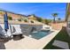 Secluded backyard features a pool with cascading waterfall and spa for ultimate relaxation at 18 Via Tiberina, Henderson, NV 89011