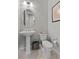 Cozy powder room featuring a pedestal sink and a framed, abstract design on the wall at 18 Via Tiberina, Henderson, NV 89011