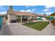 Beautiful backyard with covered patio, turf, gravel and room to entertain at 1830 Ginger Blossom Ave, North Las Vegas, NV 89031