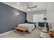 Comfortable bedroom with a ceiling fan and a large window at 1830 Ginger Blossom Ave, North Las Vegas, NV 89031