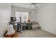 Well-lit bedroom with a desk, and a cozy seating area at 1830 Ginger Blossom Ave, North Las Vegas, NV 89031