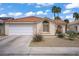 Charming single-story home with a tile roof and low maintenance landscaping at 1830 Ginger Blossom Ave, North Las Vegas, NV 89031
