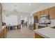 Eat-in kitchen featuring stainless steel appliances, neutral tile floors, and bright countertops at 1830 Ginger Blossom Ave, North Las Vegas, NV 89031