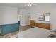 Bright main bedroom with ceiling fan, wood floors, and ensuite bathroom at 1830 Ginger Blossom Ave, North Las Vegas, NV 89031