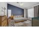 Stylish primary bedroom featuring a platform bed, sleek furnishings, and modern decor at 1830 Ginger Blossom Ave, North Las Vegas, NV 89031