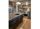 Island kitchen with granite countertops and stainless steel appliances at 210 Lailani St, Las Vegas, NV 89110