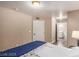 Bedroom with a bed, and an ensuite bathroom with neutral color walls and hardwood floors at 2110 Sleepy Ct, Las Vegas, NV 89106