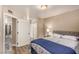 Comfortable bedroom with a bed, closet, and natural light filtering through the window at 2110 Sleepy Ct, Las Vegas, NV 89106