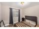 Bedroom featuring a window and hardwood floors with neutral colored walls at 2110 Sleepy Ct, Las Vegas, NV 89106