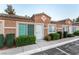 Street view showing townhome with well-maintained front yard and accessible parking at 2110 Sleepy Ct, Las Vegas, NV 89106