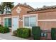 Close-up exterior of townhome with neat shrubs and clear address numbers at 2110 Sleepy Ct, Las Vegas, NV 89106
