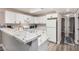 Bright kitchen showcasing granite counters, white cabinets, and ample counter space at 2110 Sleepy Ct, Las Vegas, NV 89106