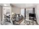 Comfortable living room featuring a sofa, TV, and an open doorway at 2110 Sleepy Ct, Las Vegas, NV 89106