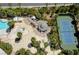 Aerial view of a pool, tennis court, patio and common outdoor areas with palm trees at 222 Karen Ave # 1804, Las Vegas, NV 89109