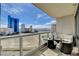 Enjoy city views from this home's outdoor living space with modern seating at 222 Karen Ave # 1804, Las Vegas, NV 89109