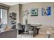 Dining area with modern art, shelving, and access to kitchen area at 222 Karen Ave # 1804, Las Vegas, NV 89109