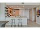 Stylish kitchen with a breakfast bar, granite countertops, and modern appliances at 222 Karen Ave # 1804, Las Vegas, NV 89109
