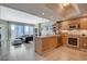 Bright and airy living room flows into an open kitchen with granite countertops and stainless steel appliances at 222 Karen Ave # 1804, Las Vegas, NV 89109