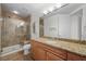 Bathroom with tiled floors, granite countertops, and glass shower at 2260 Village Walk Dr # 1305, Henderson, NV 89052