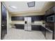 Well-appointed break room with ample cabinetry, modern appliances, and a convenient countertop at 2260 Village Walk Dr # 1305, Henderson, NV 89052