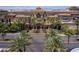 Exterior view showcasing the casino entrance framed by lush palm trees and well maintained landscaping at 2260 Village Walk Dr # 1305, Henderson, NV 89052